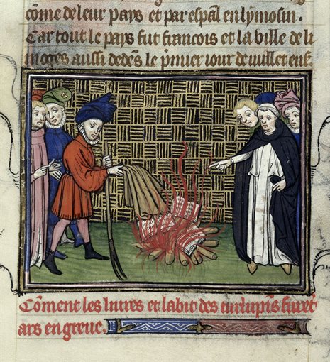 Detail of a miniature of heretical books and robes of the Turlupins burnt, at the beginning of chapter 38 of 'Charles V' book.