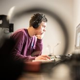 male-student-headphones-mac-suite