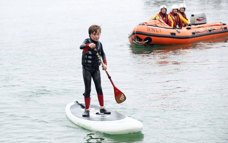 Asher on his paddleboard during the day's challenge Image by Gareth Davies Photography