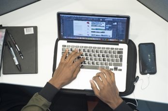 Somebody's hand using a laptop