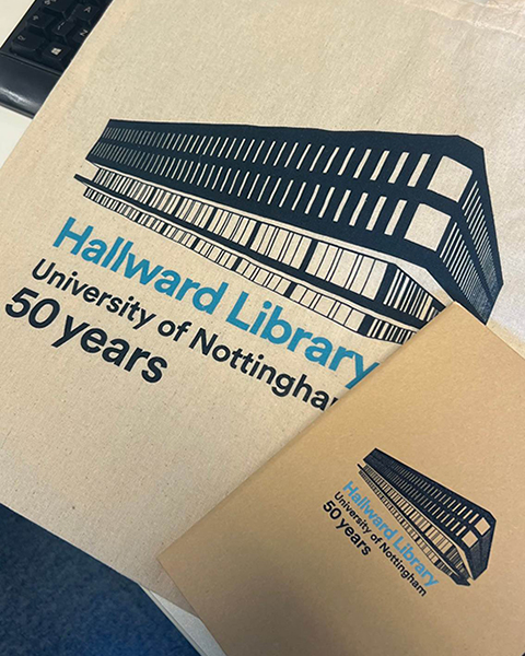 Hallward Library 50 years notebook and tote bag