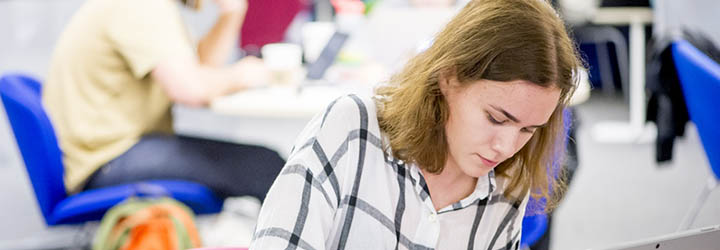 Student looking down and studying