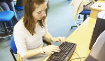 Image of a female student studying at a computer