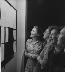 Female students gathered around a noticeboard in the Trent Building, c.1949