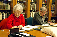 Volunteers working on manuscript and printed collections