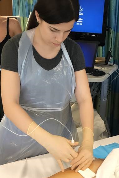 Natalie Shur performing procedure on patient