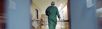 Doctor walking down a hospital corridor