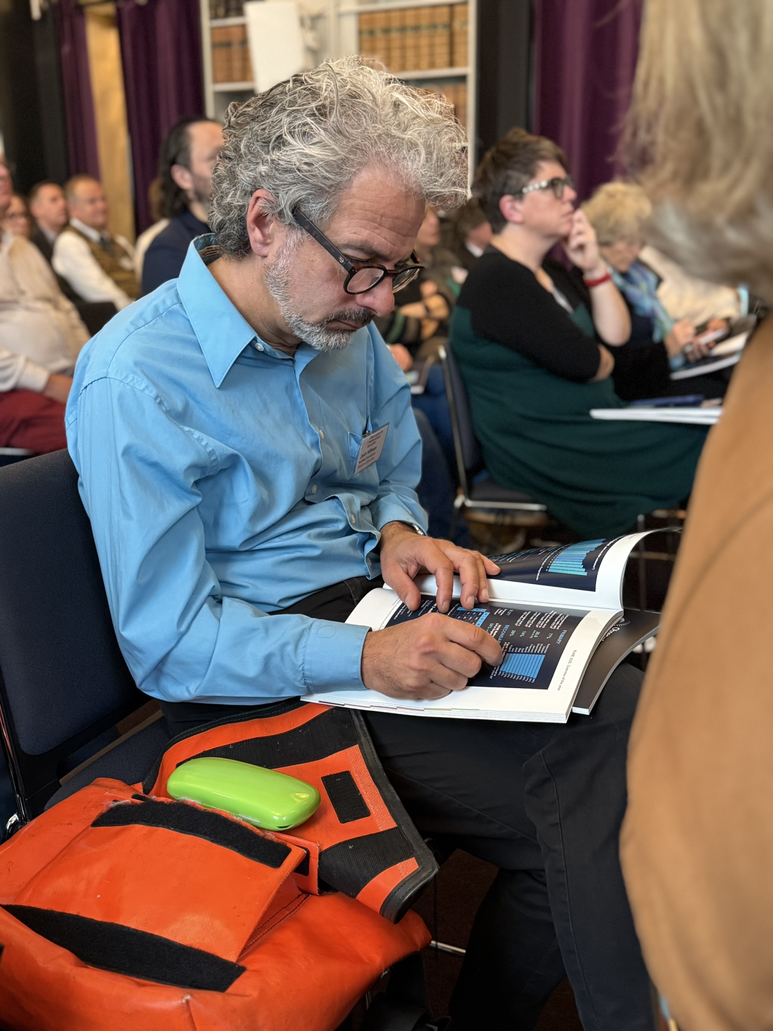 Man reading RoME report