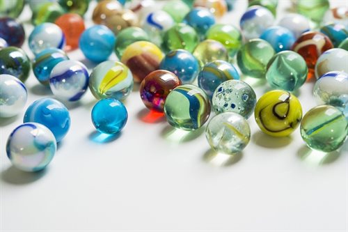 A collection of different marbles of varying colours and patterns