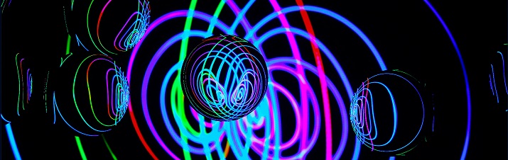 Spheres against a backdrop of  green, blue and purple interlinking rings