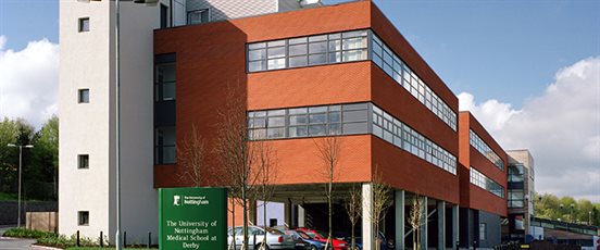 Modern orange and white building which is home to the Medical School at the Royal Derby Hospital
