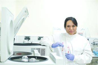 Melanie Lingaya, senior lab technician working with samples in laboratory