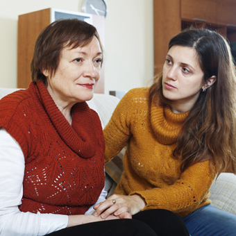 Daughter helping mother