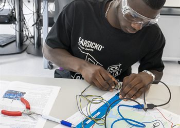 Summer school participant experimenting with electronics