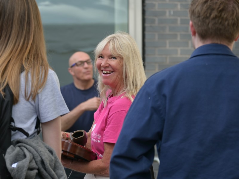 Woman smiling with British Transplant Games baton