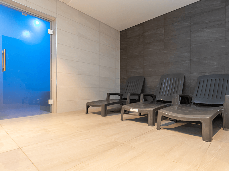 Three loungers in the Health and Wellbeing Suite, next to the steam room