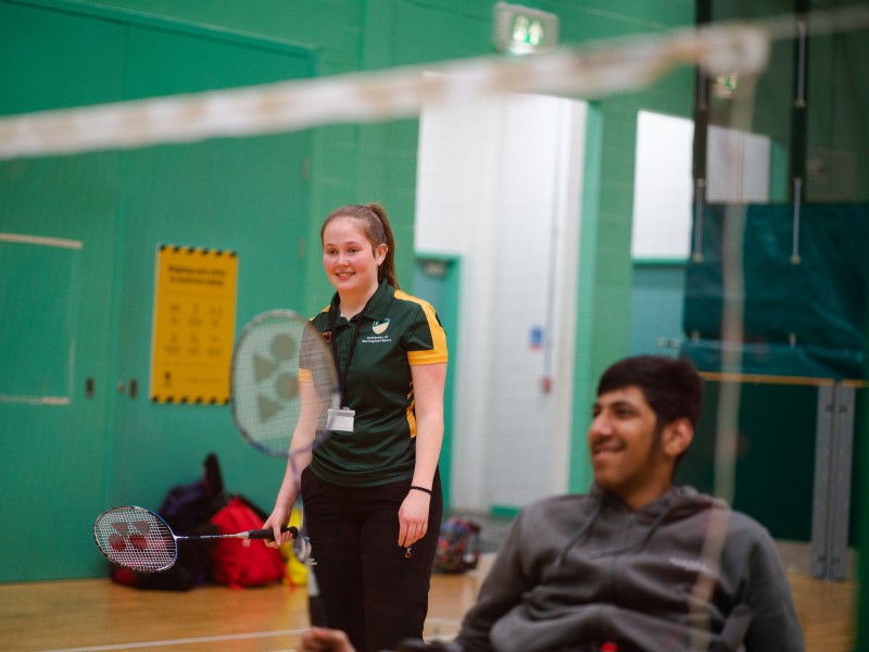 UoN Sport staff member supports an inclusive badminton session