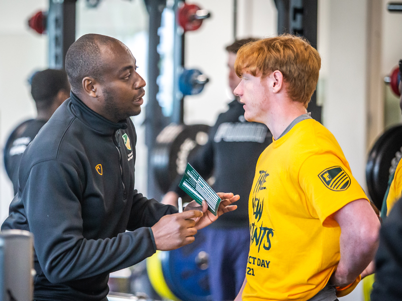 University of Nottingham American Football player with a coach in the gym