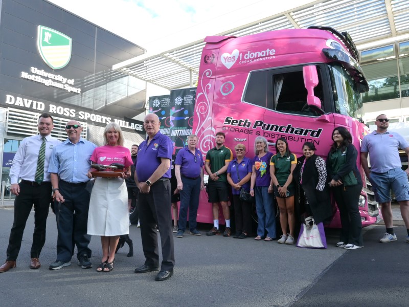 Group photograph with British Transplant Games baton in front of David Ross Sports Village 