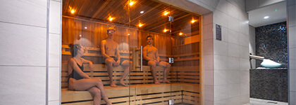 Three members relaxing in our Finnish sauna in the Health and Wellbeing Suite at David Ross Sports Village