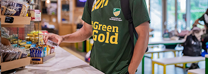 Shop Official Leisurewear from University of Nottingham Sport - Student buying food in the cafe
