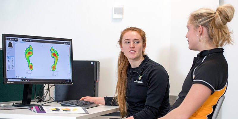 A clinician providing gait analysis using Footscan® technology in our Sports Injury Clinic