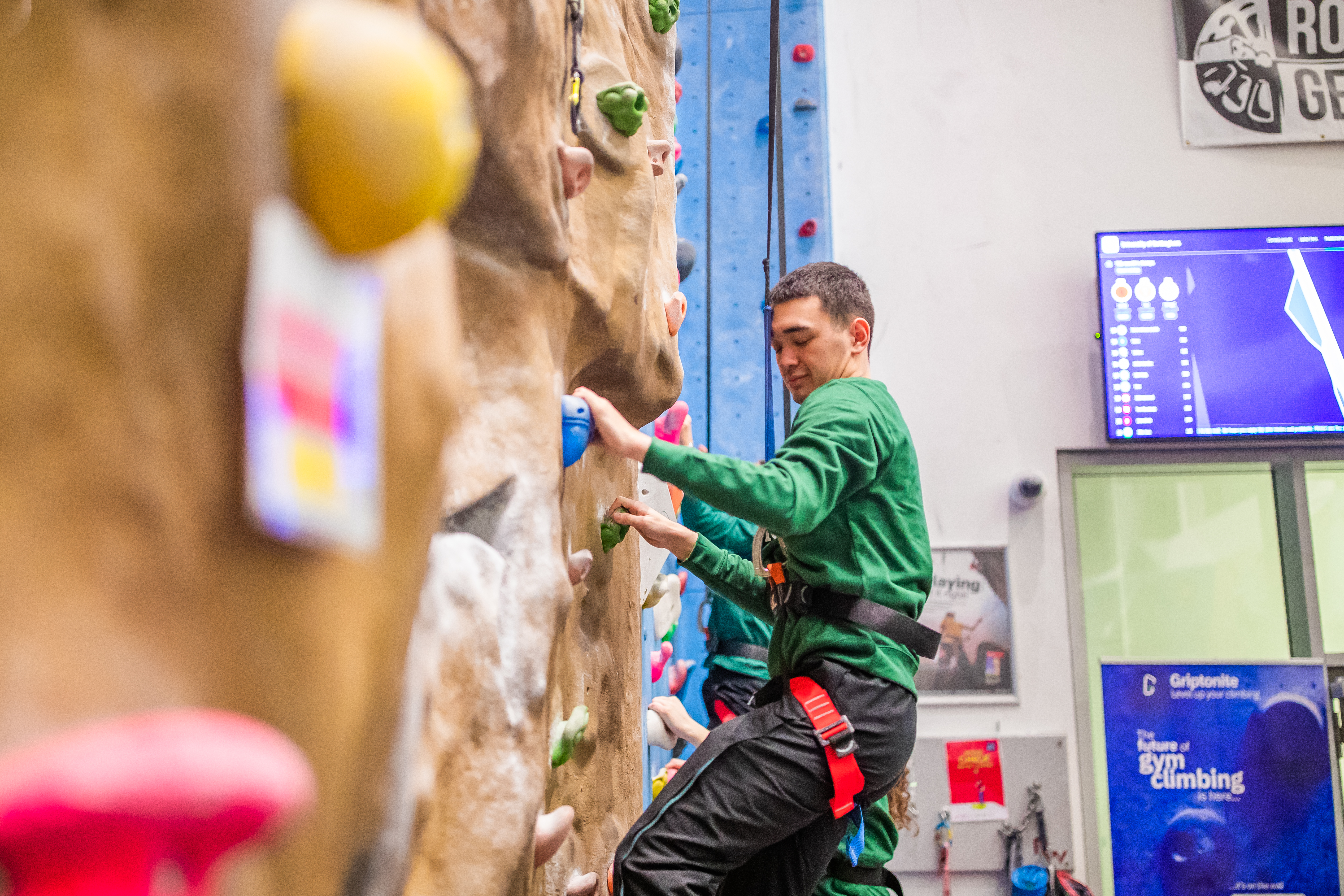 Male student at David Ross Sports Village climbing wall