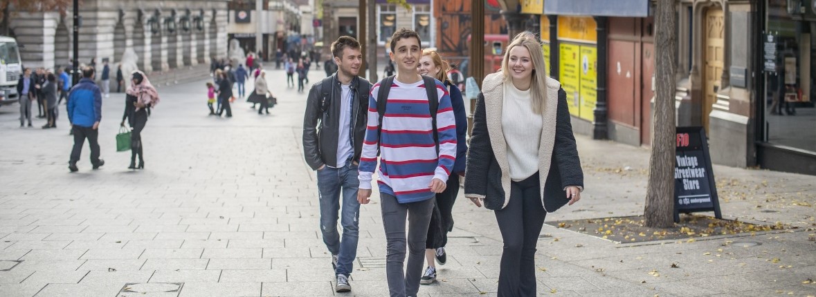 Undergraduate students walking through Nottingham City Centre