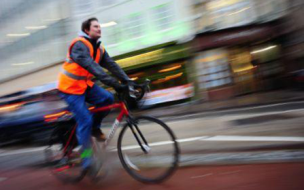 Cyclist wearing bright reflective clothing