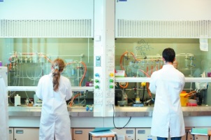 Two chemistry students researching drug discovery in a laboratory on University Park campus