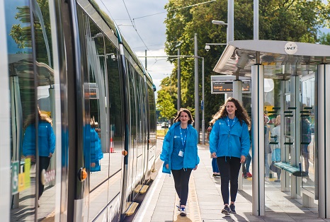 Two students at University of Nottingham tram stop