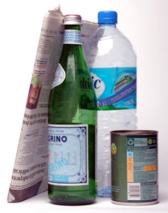 Newspaper, bottles and can for recycling