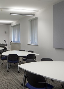 Plectrum tables with chairs in seminar room