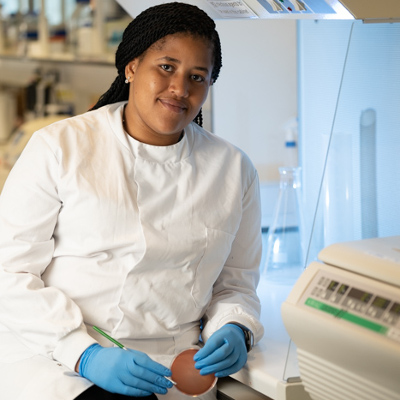 PhD student sat in a lab