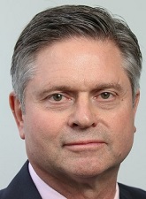 Head and shoulders photo of Graeme Pike. Graeme is wearing a white shirt and dark jacket.