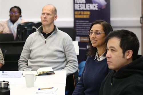 Avni Sondagar is shown listening to a speaker, alongside other participants, during a Help to Grow: Management workshop.