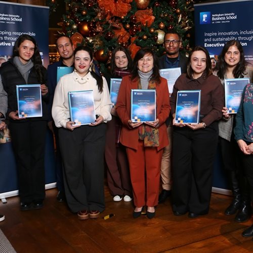 Participants from the Pecege Digital Strategy Immersion Week pose for a group photo whilst holding their participation certificates.