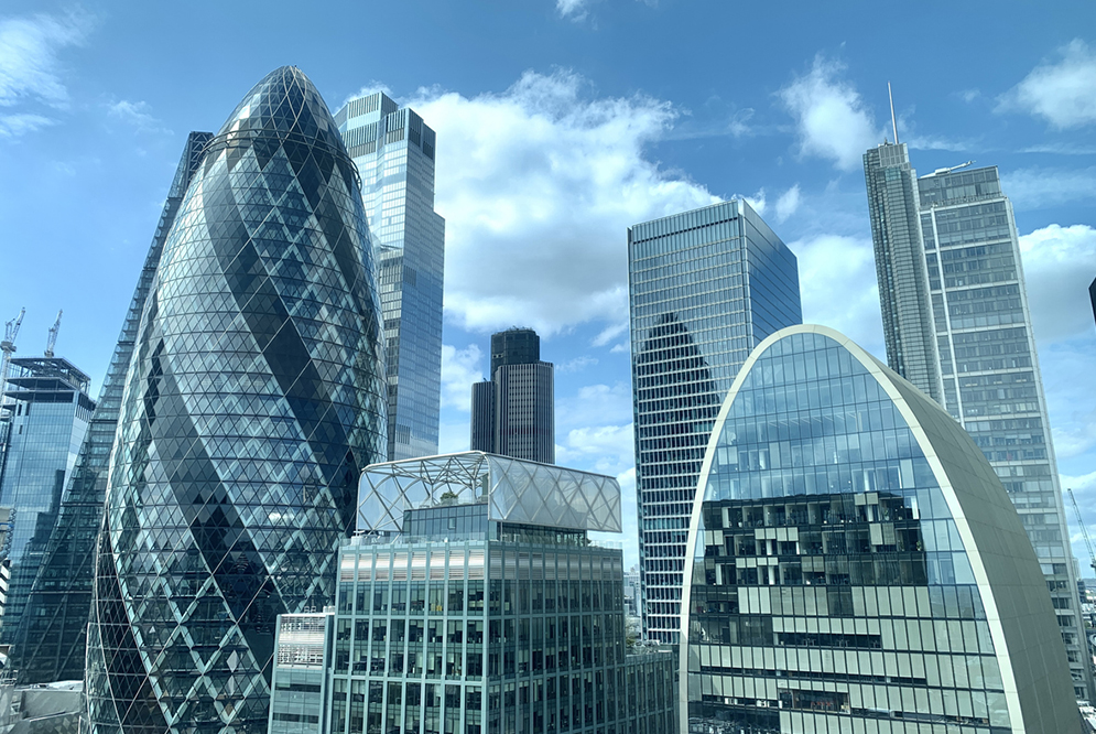 Glass fronted building of the London financial district skyline.