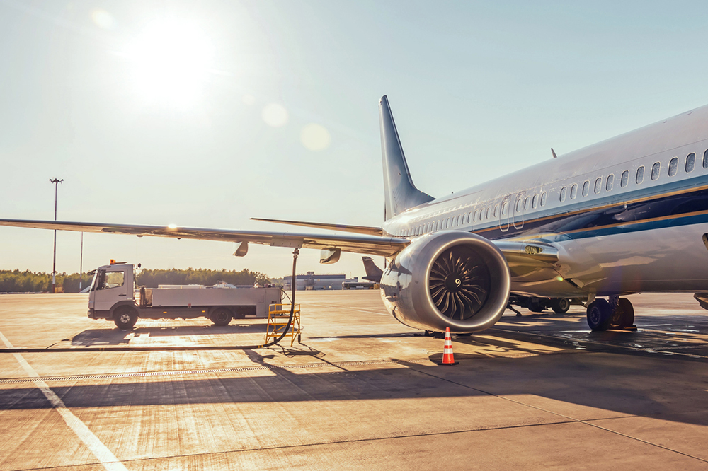 Photo of a plane being re-fuelled.