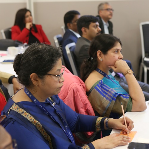 Group photo of participants from the programme standing outside the Bank of England.