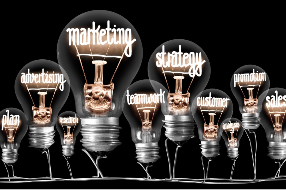 Light bulbs concept - light bulbs with marketing words inside them such as, strategy, marketing, team work.