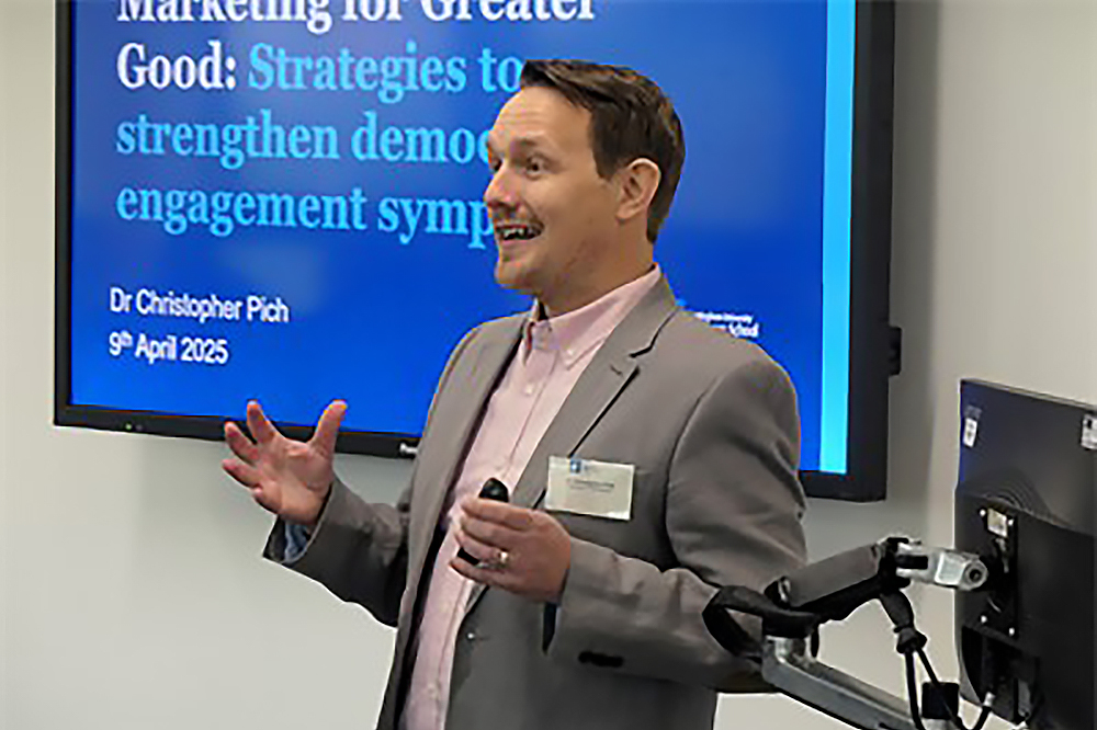 Dr Christopher Pich giving a presentation.