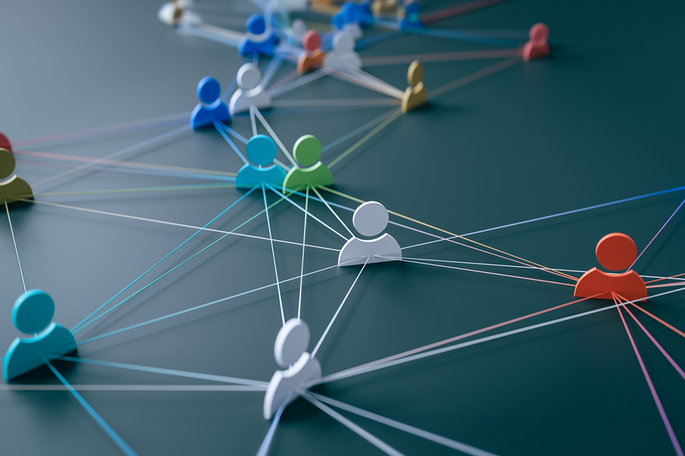 Concept graphic depicting connectedness by showing people shaped icons and lines between them indicating links.
