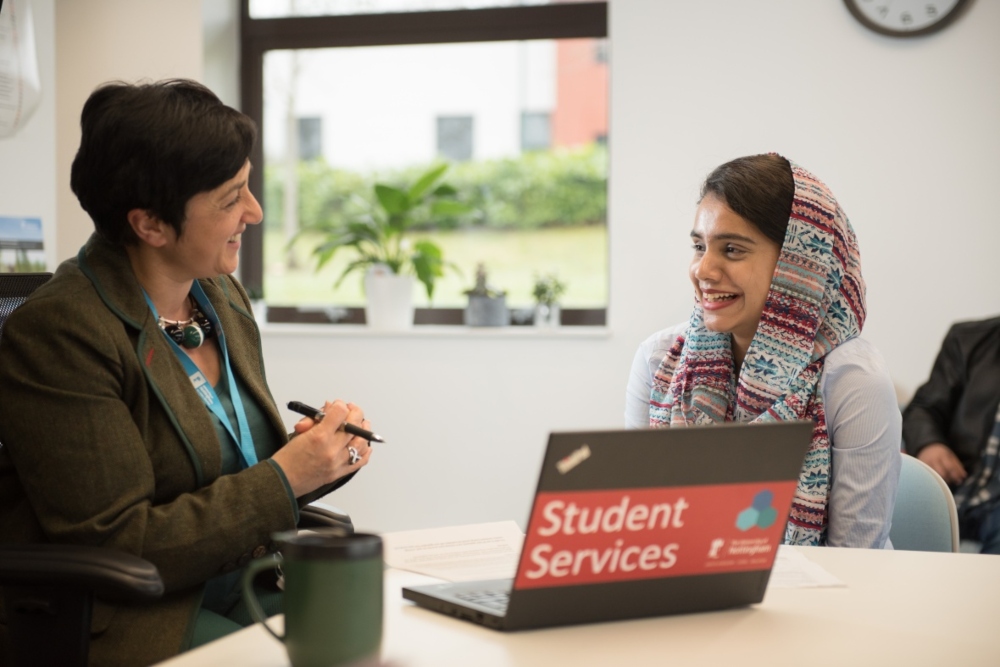 Student talking to a staff member of Student Services