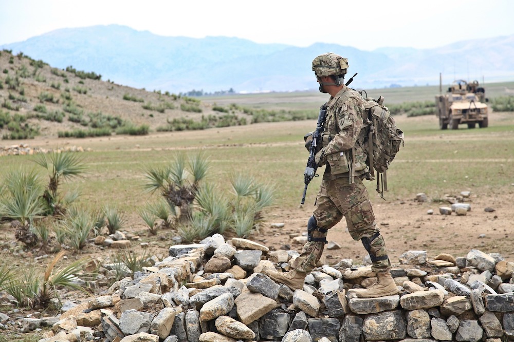 Soldier walking along a battlefield