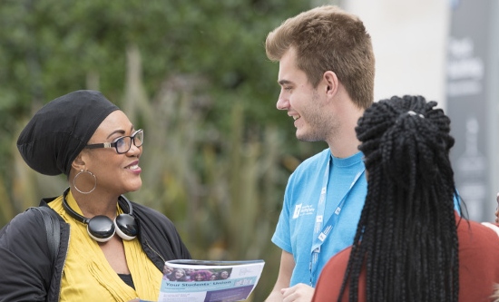 Parent talking to a student ambassador at an Open Day