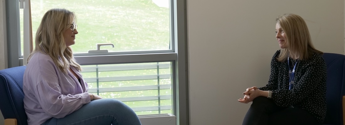 Student sitting with an adviser