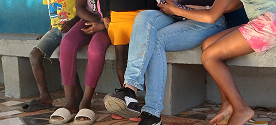 legs of people sitting down