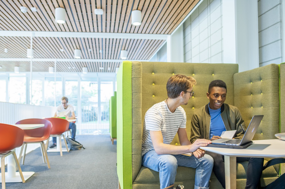 Two students study in the Monica Partridge building