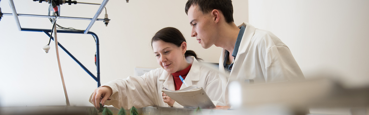 Two students working in a lab